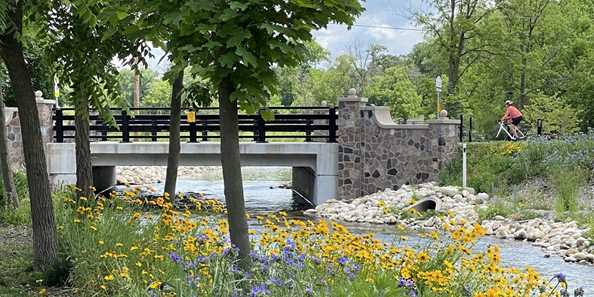 Summertime with flowers along the Bark River