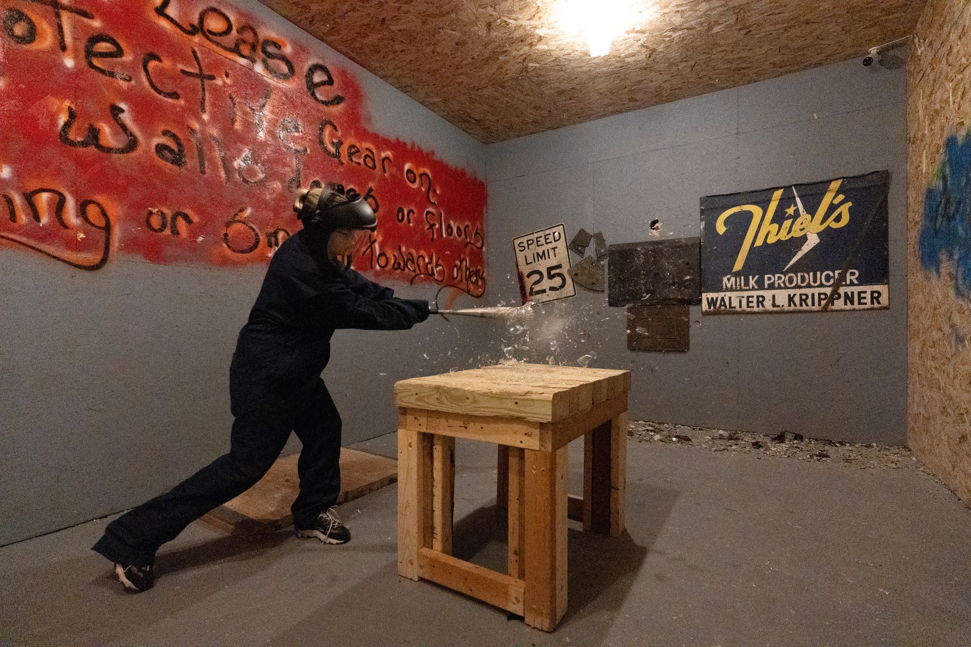 crusched smash room person hitting glass vase with fragments