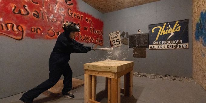 crusched smash room person hitting glass vase with fragments