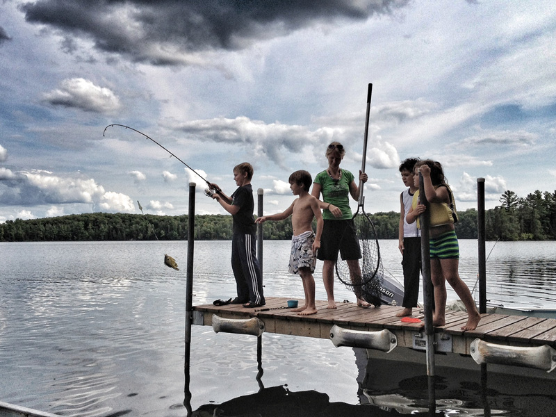Families having fun fishing