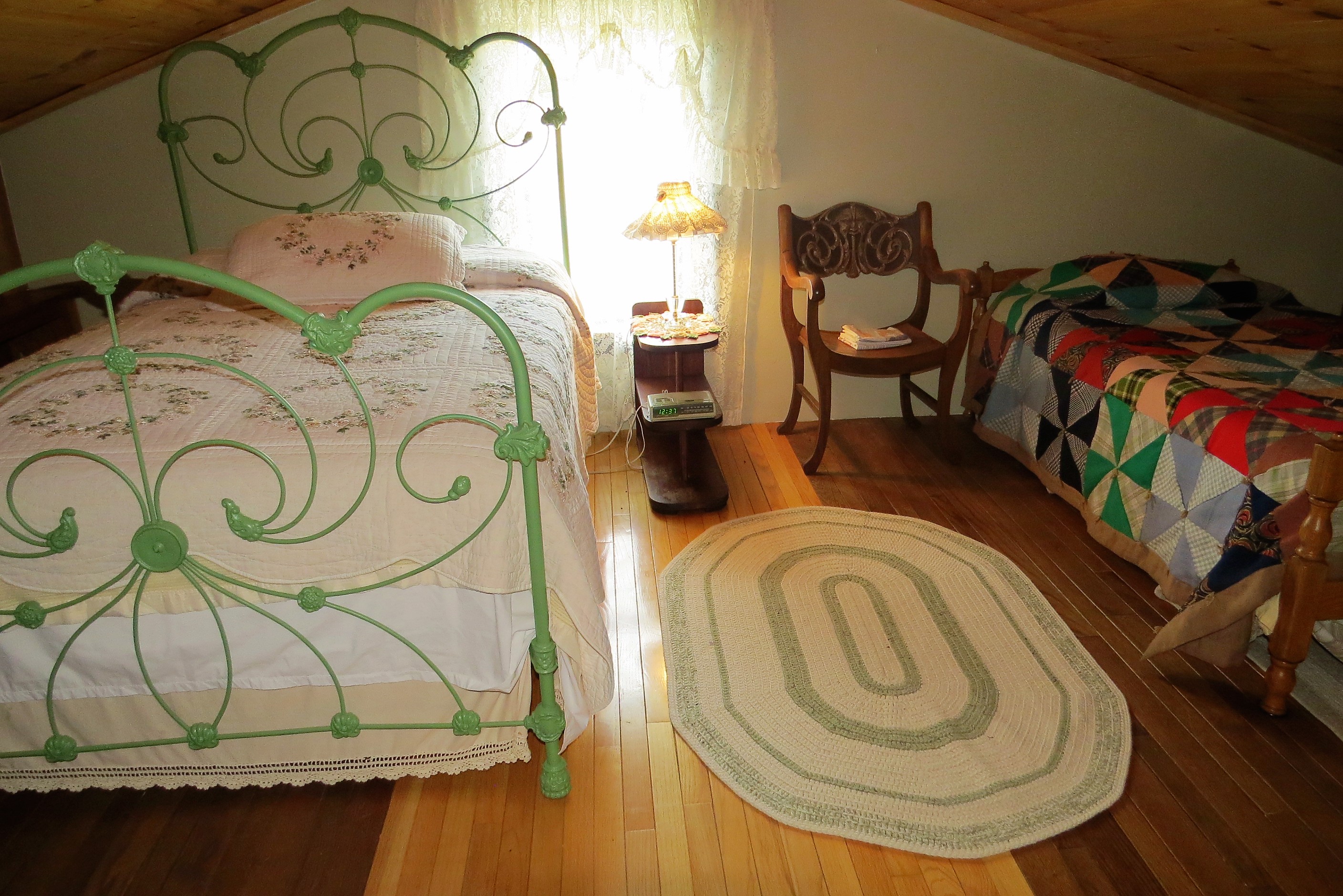 Bedroom 3 - Loft with a double antique iron bed, and a single bed.
