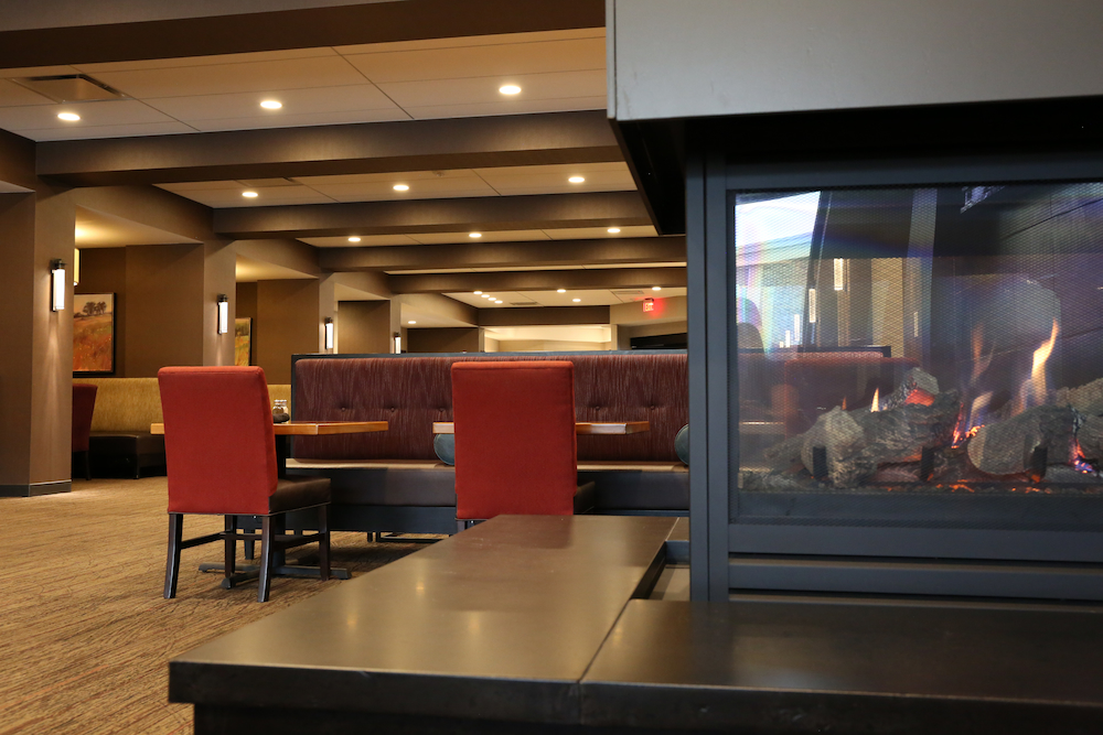 Seating near cozy fireplace at Libby McNeill's.