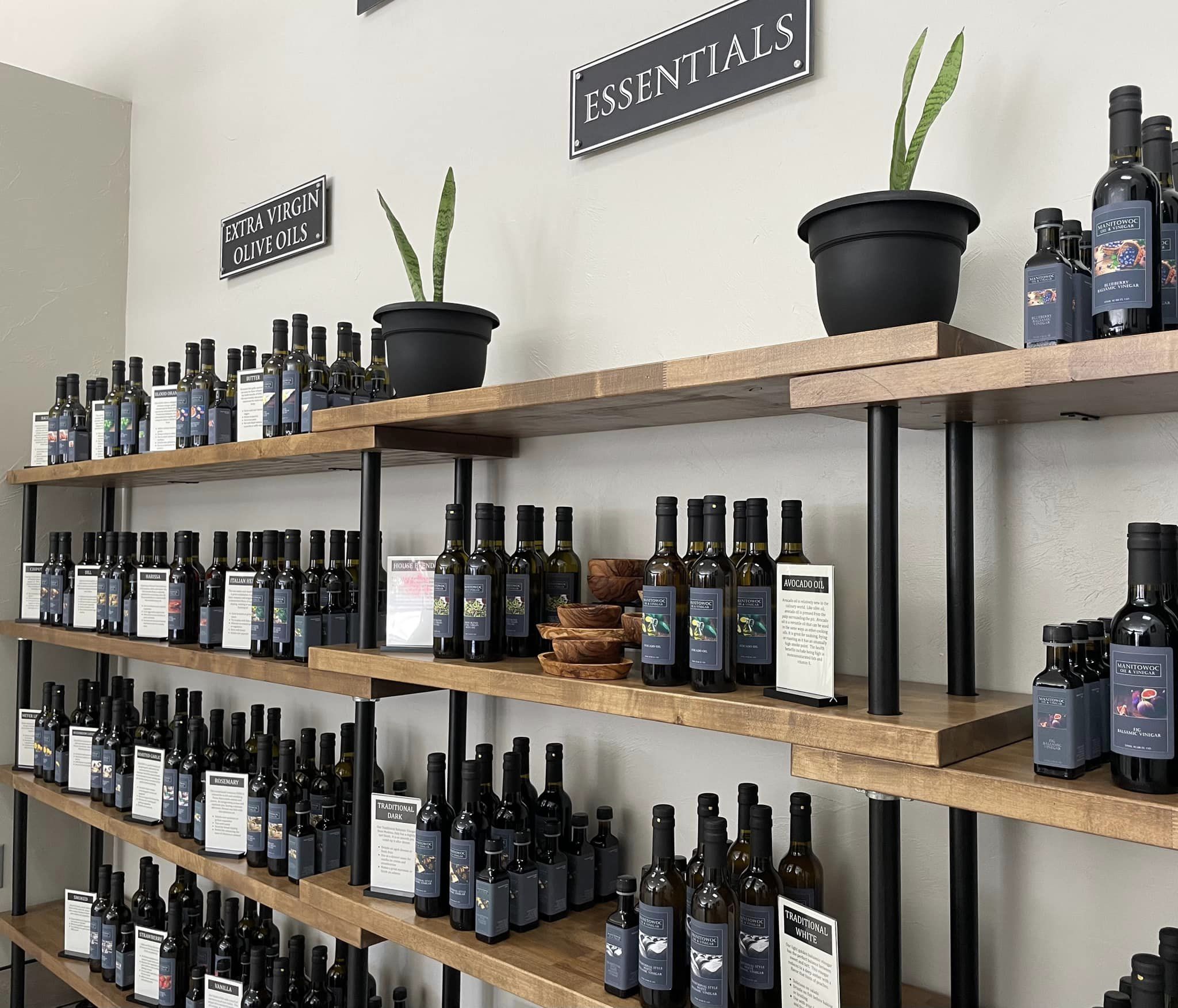 Olive oils and vinegar in bottles on shelves