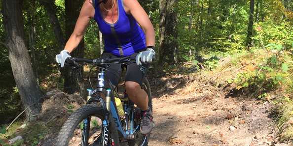 Pedaling the hill on the Jack Lake Mountain Bike Trail.