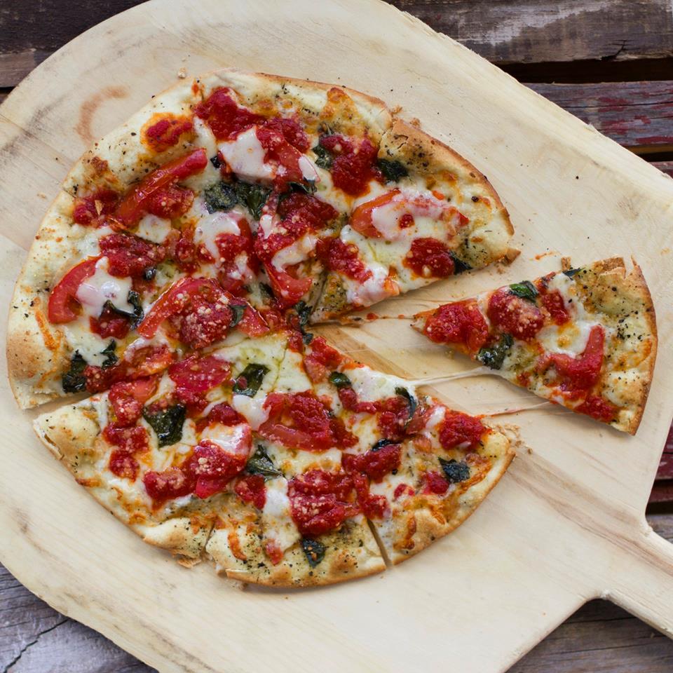 My Maria - our take on a classic margherita pizza. Olive oil, fresh basil, tomatoes, provolone, mozzarella on our made from scratch dough. Baked in our brick-oven for crisp!