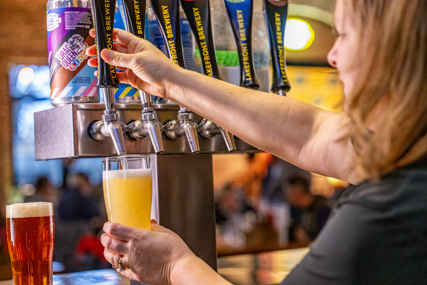 Bartender Pours A Beer At Lakefront Brewery In Milwaukee