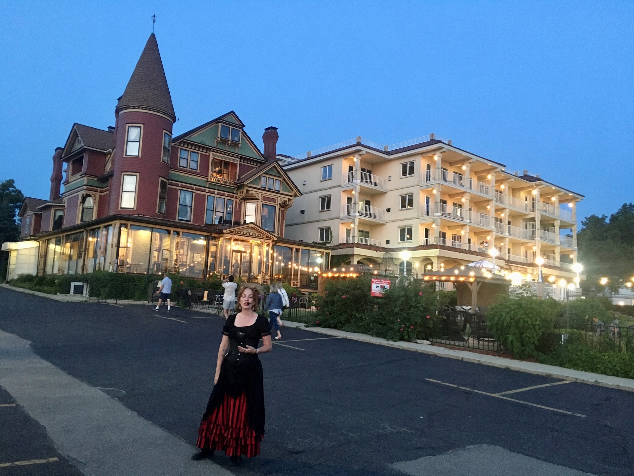 Tour guide in front of the Baker House in Lake Geneva.