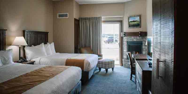 Double Queen Fireplace room at The Lodge At Mauston