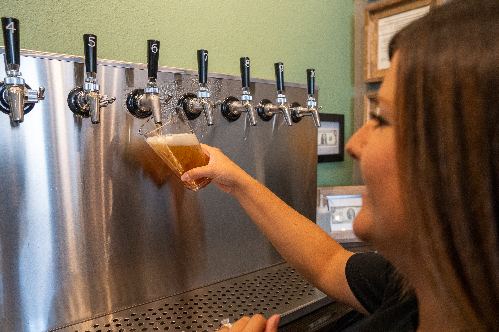 Brittany pouring at Craft Creek Brewing