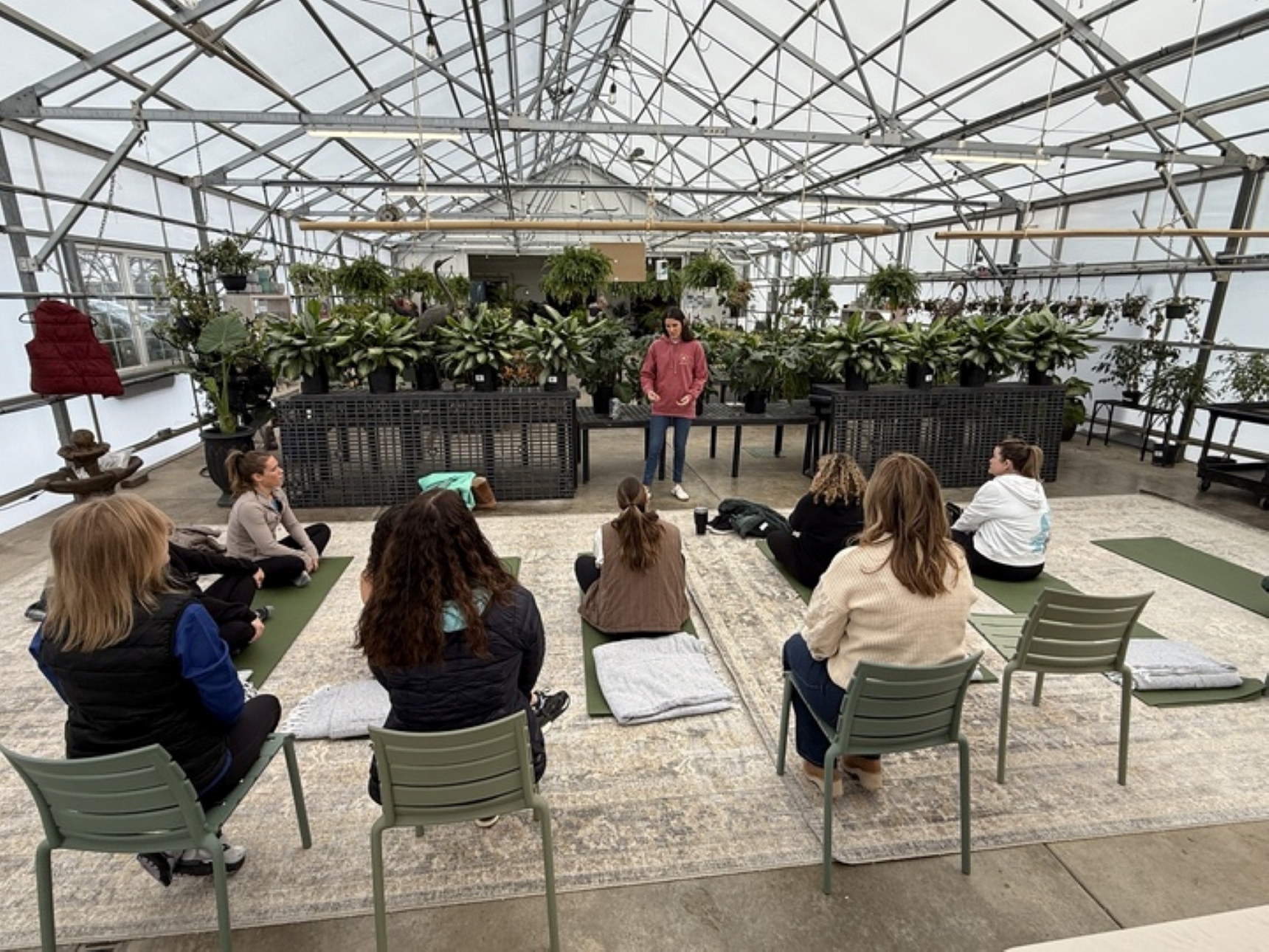 Yoga class in the green house at Healing Grounds