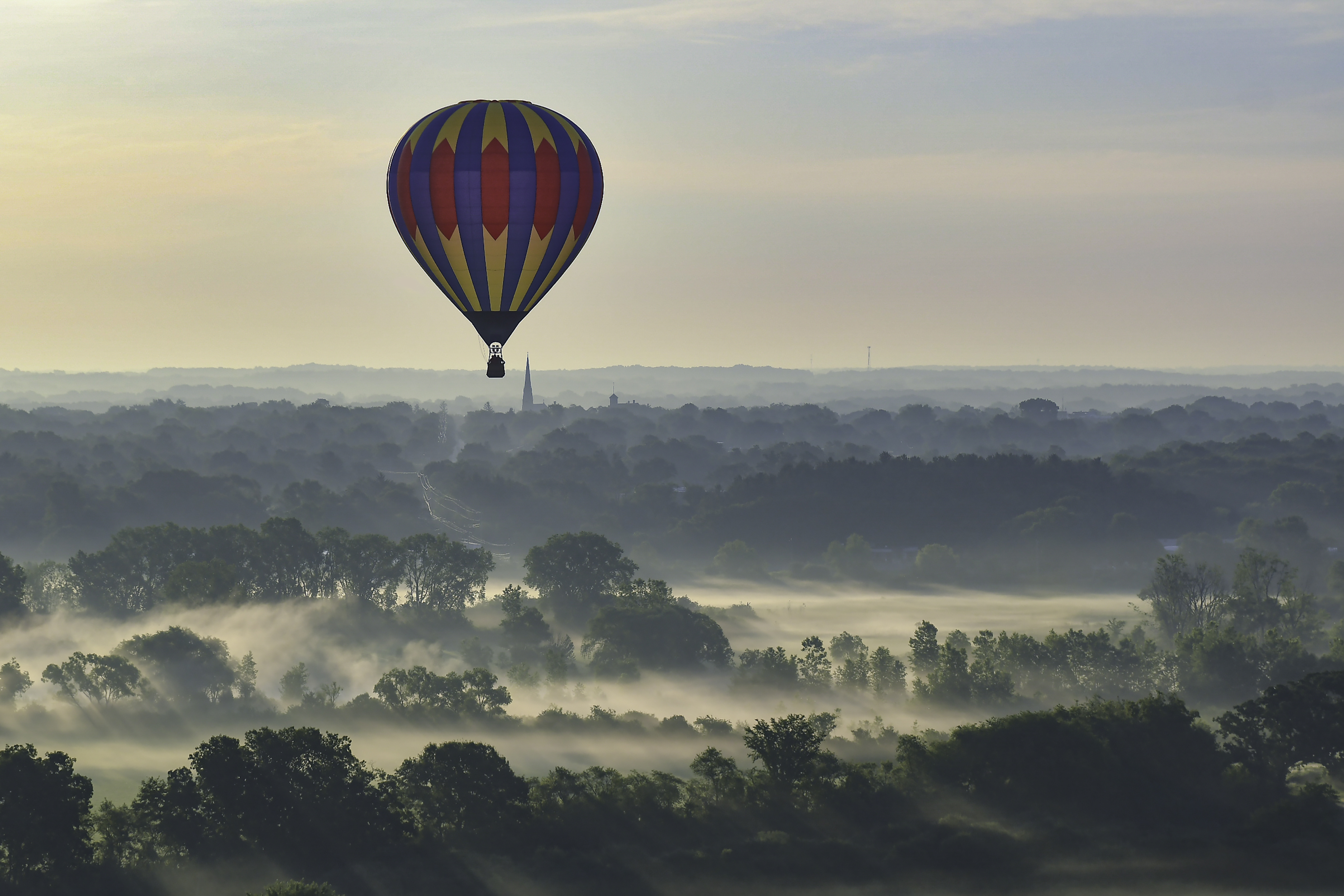 Balloon on a foggy morning.