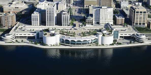 The Frank Lloyd Wright-designed Monona Terrace is located in heart of Madison’s vibrant downtown on the shore of Lake Monona two blocks from the Capitol.  This spectacular multi-level structure offers 85,000 square feet of meeting and exhibition space, striking lake views, extensive rooftop gardens and an attached 240-room Hilton hotel.