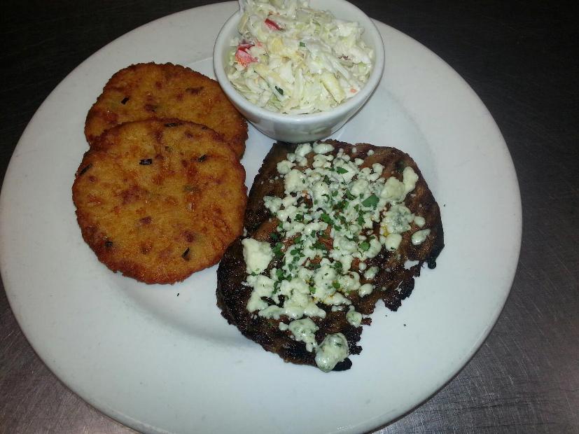 A hearty meal that satisfies: grilled prime rib with potato cakes and coleslaw at The Alley.