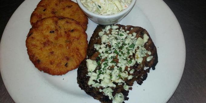 A hearty meal that satisfies: grilled prime rib with potato cakes and coleslaw at The Alley.