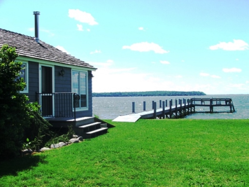 Enjoy this beautiful view everyday of your vacation.  Cabana house, great swimming, shallow sandy bottom waters!  A perfect vacation rental!