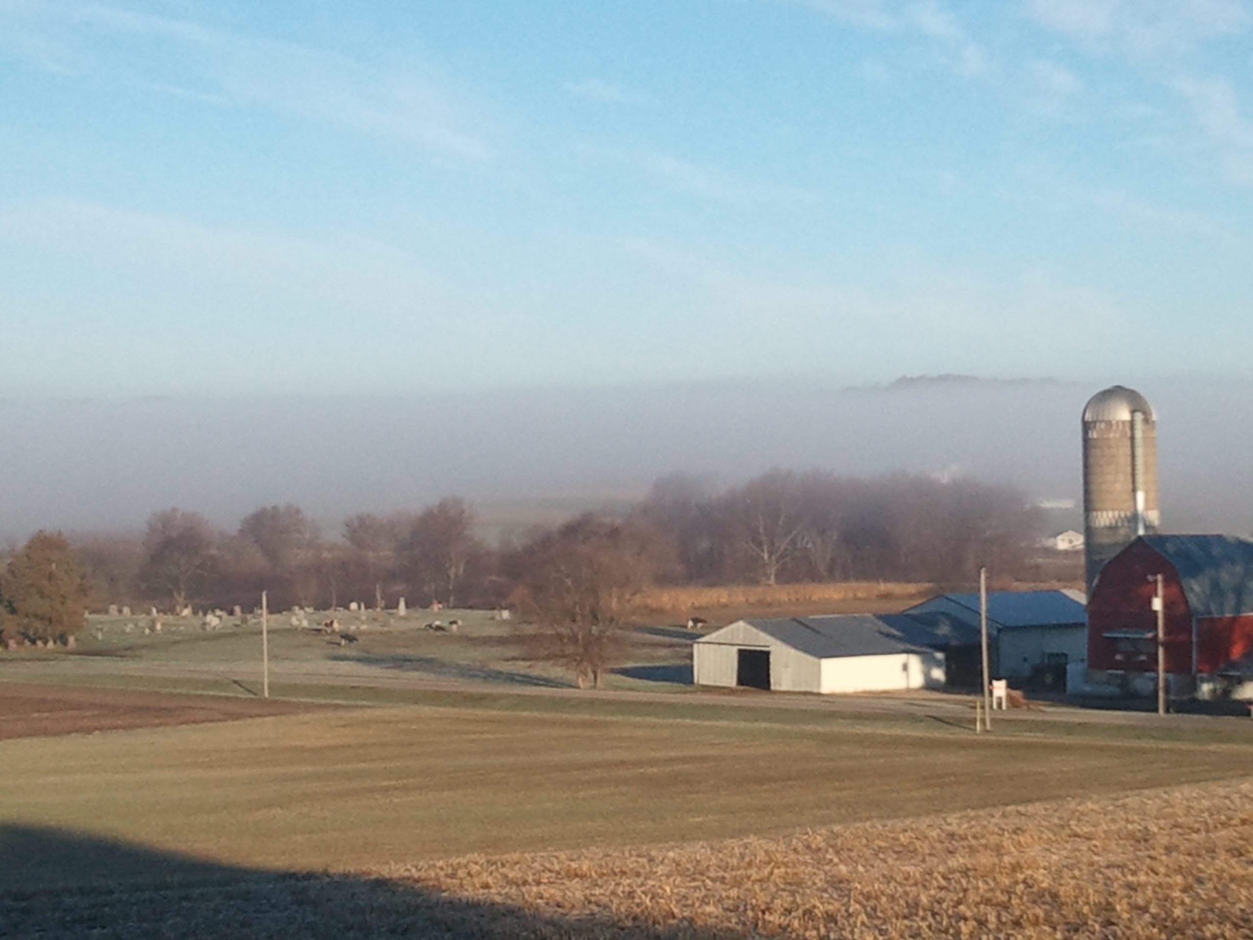 Low lying fog in the valley over our neighbor's farm.
