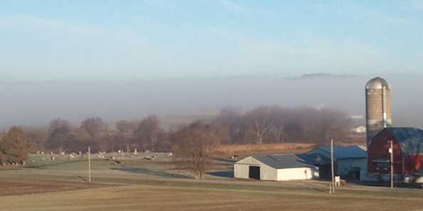 Low lying fog in the valley over our neighbor&#39;s farm.