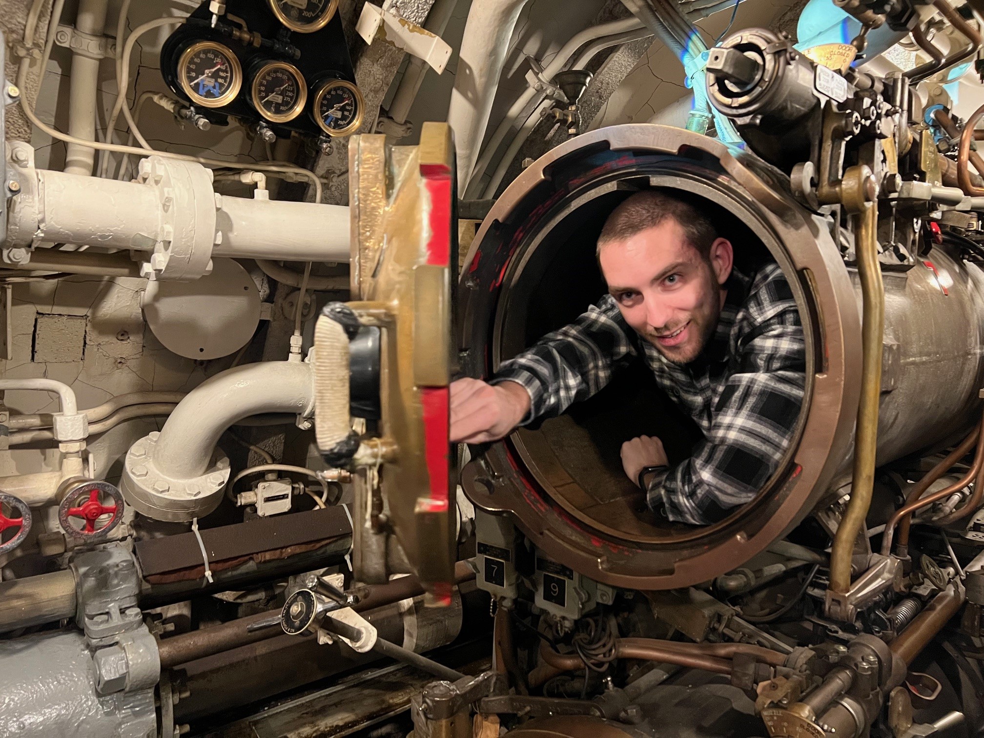 man in torpedo hole in USS Cobia