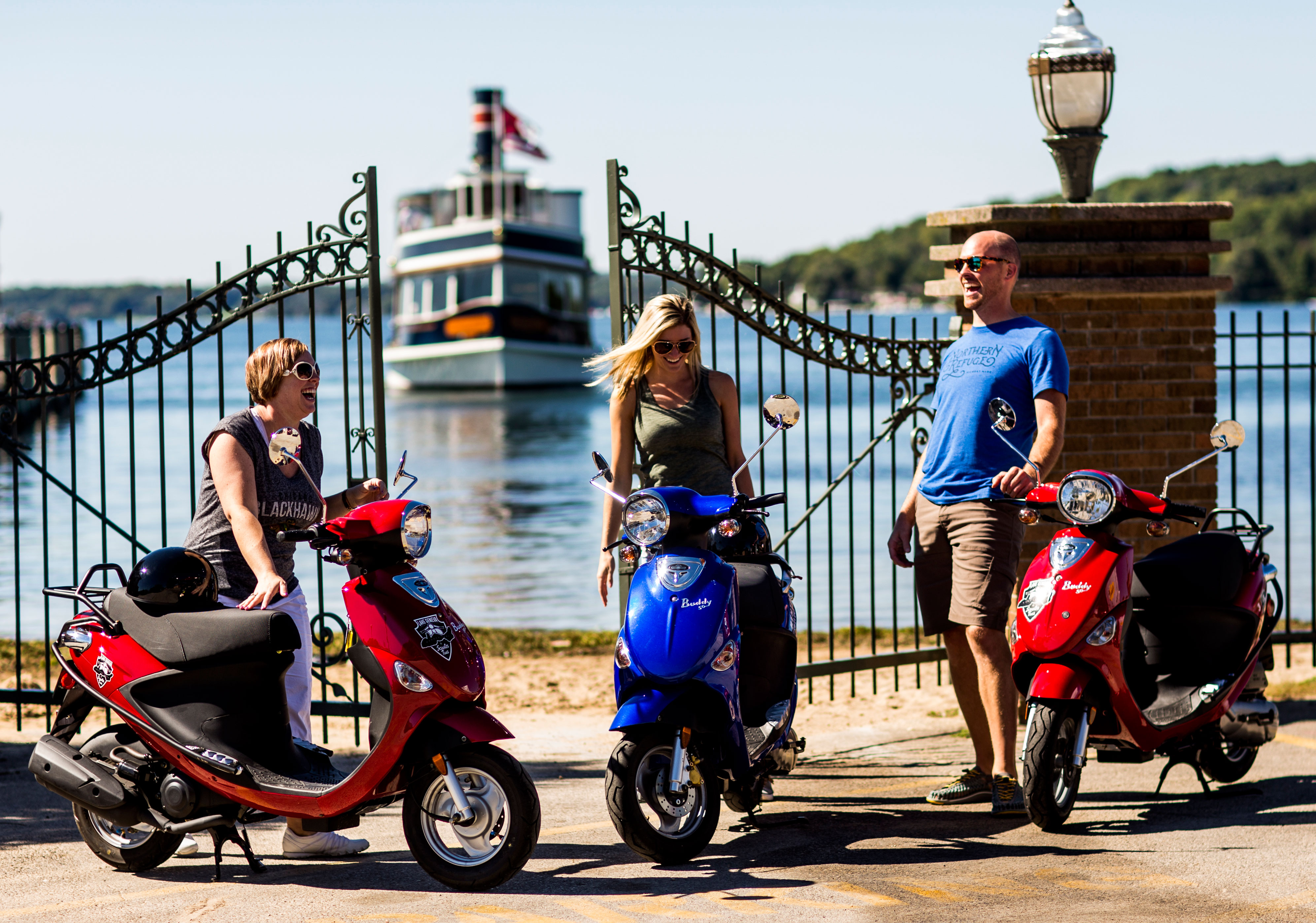 People on scooters by Geneva Lake.