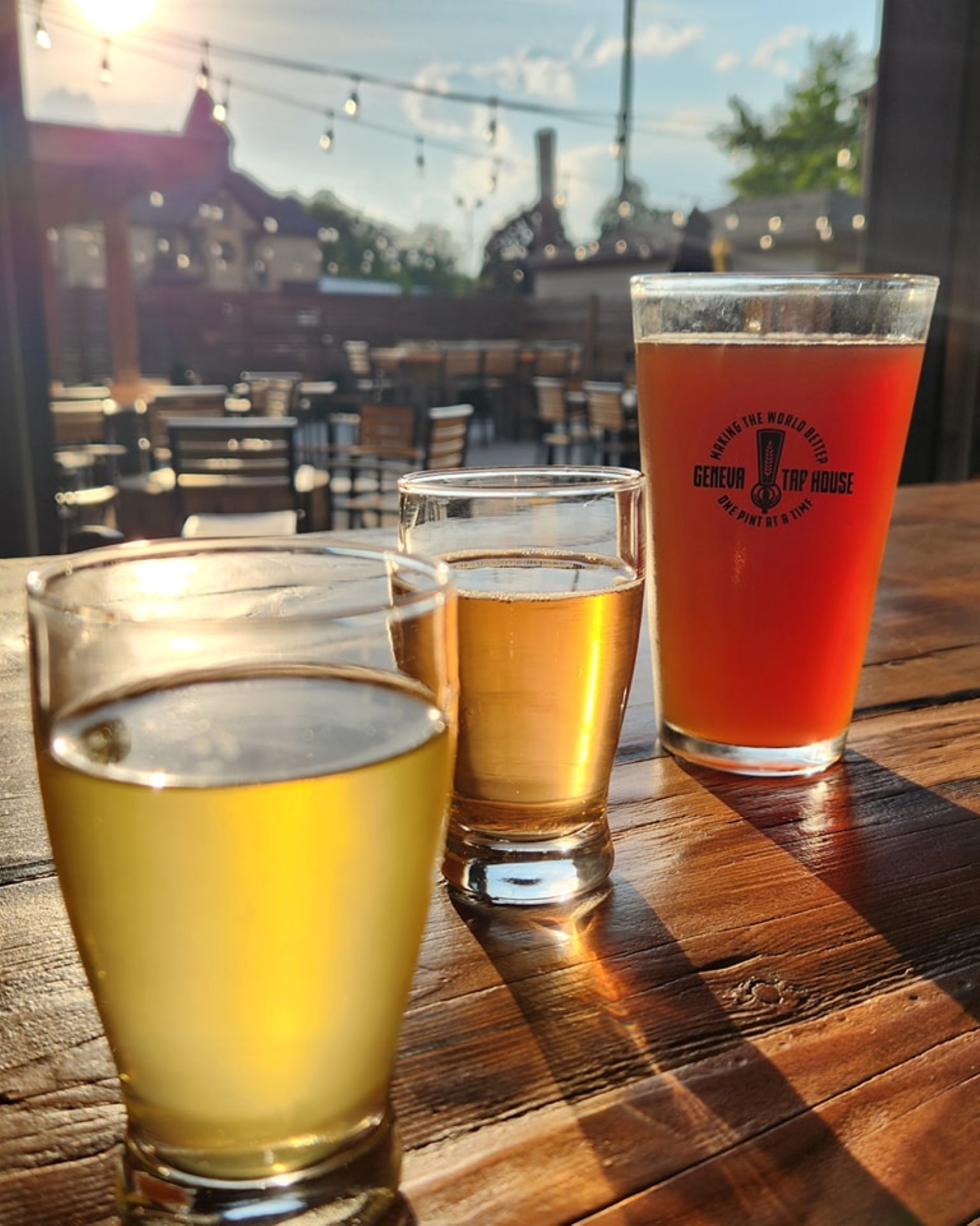 Beers on a table on the patio at Geneva Tap House.