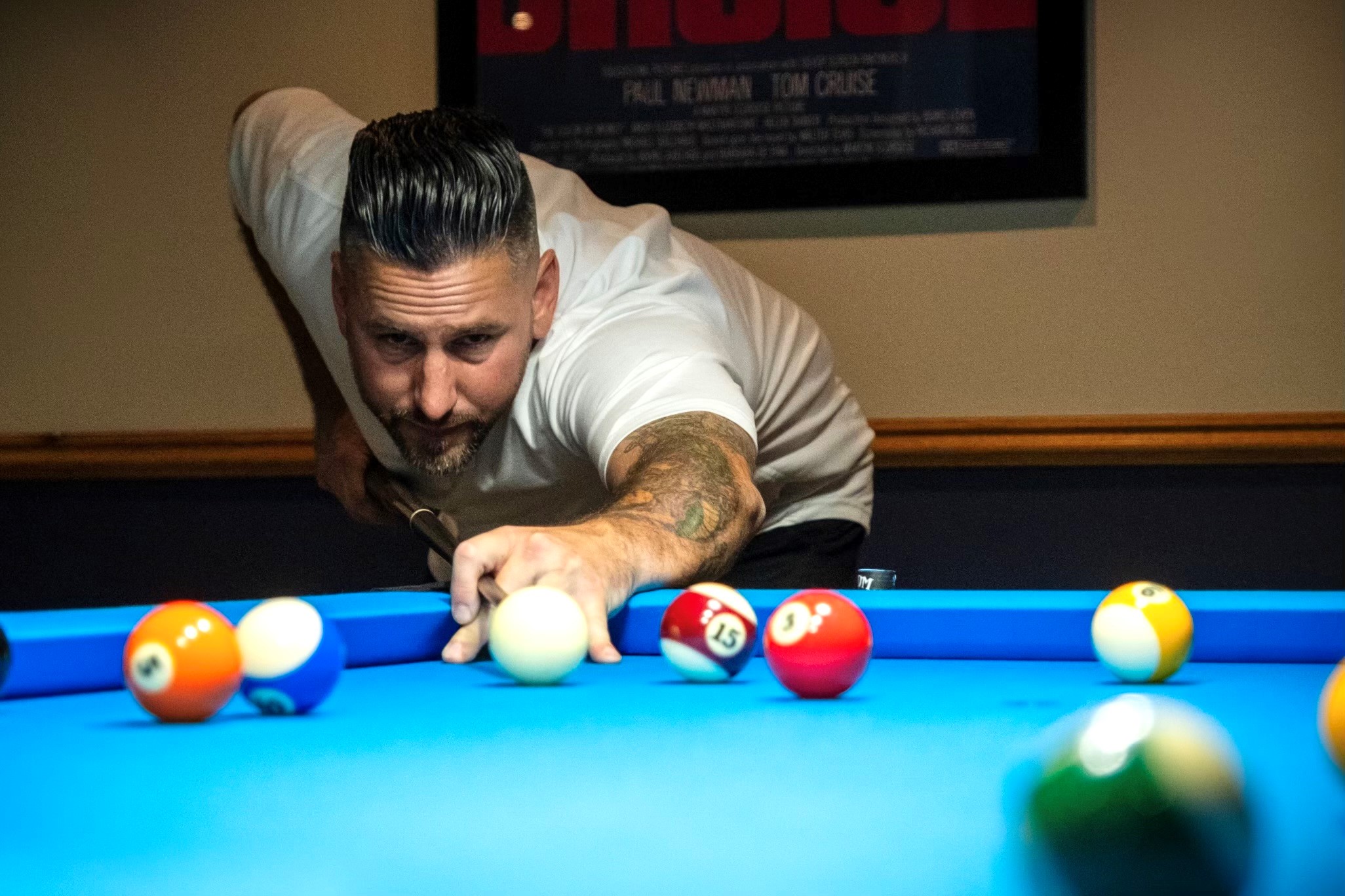 Playing a game of pool.