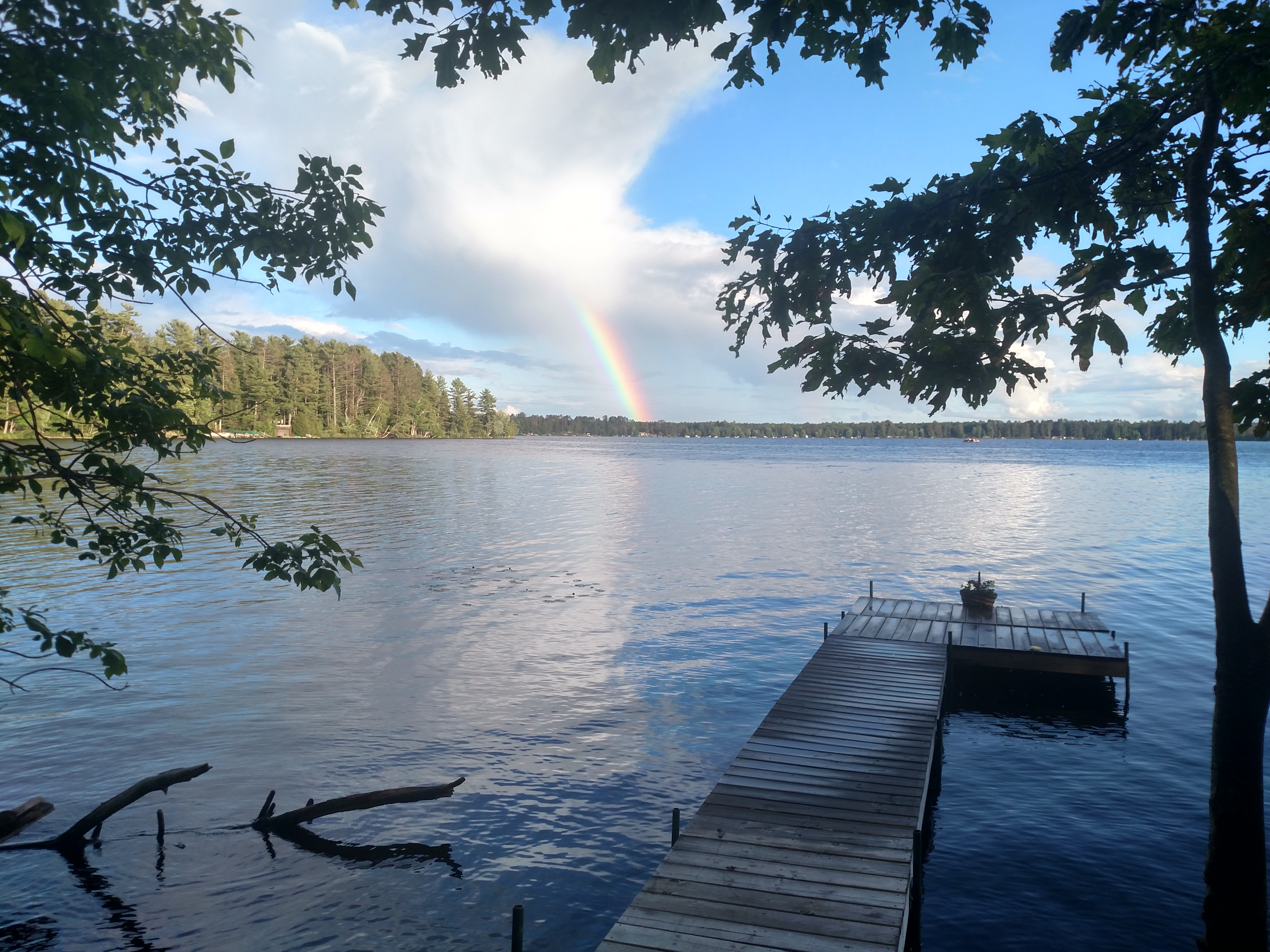A rainbow over a dock on Post Lake, near the dam.