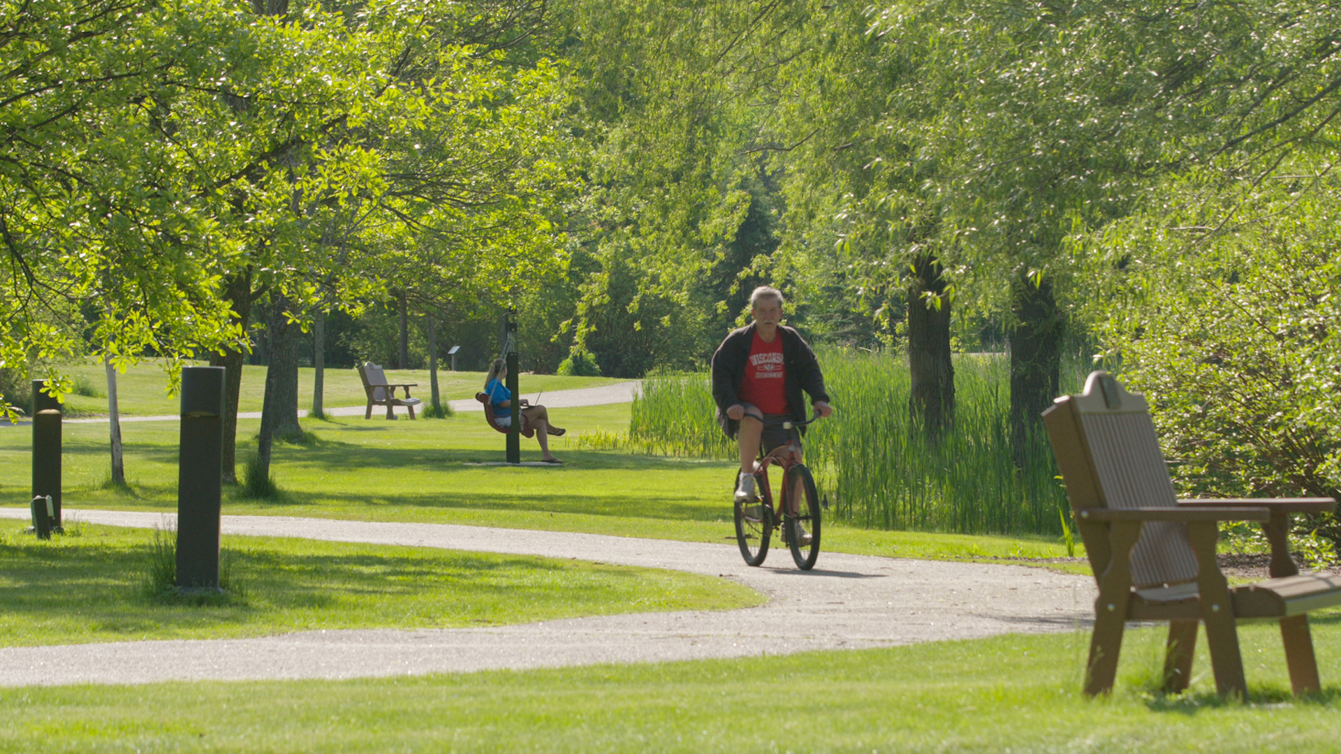 Biking the Springbrook Trail along Antigo Lake.