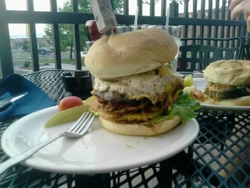 Enjoy a savory Brew House Burger on The Alley's upstairs outdoor patio.