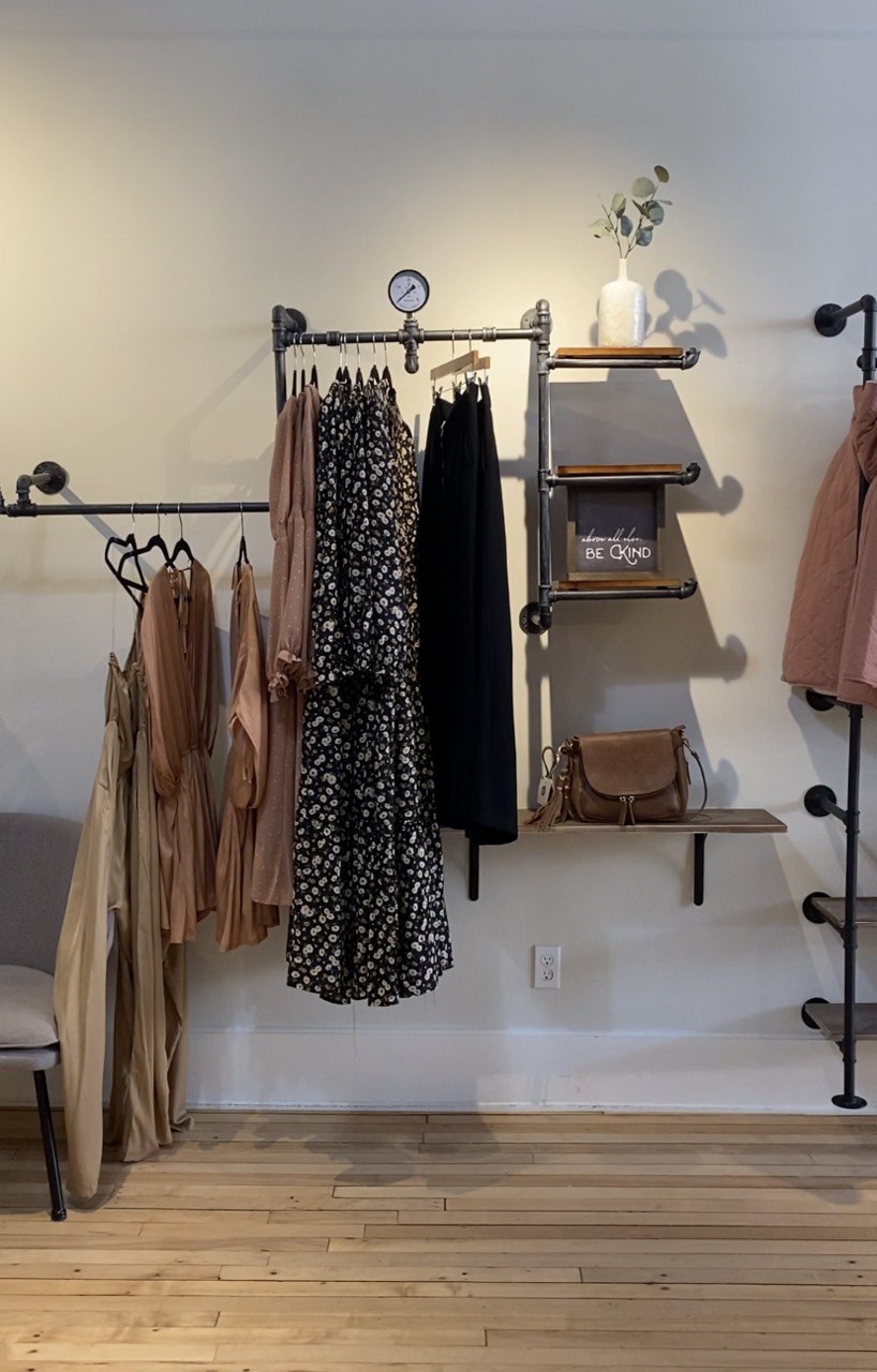clothing racks on wall at graced